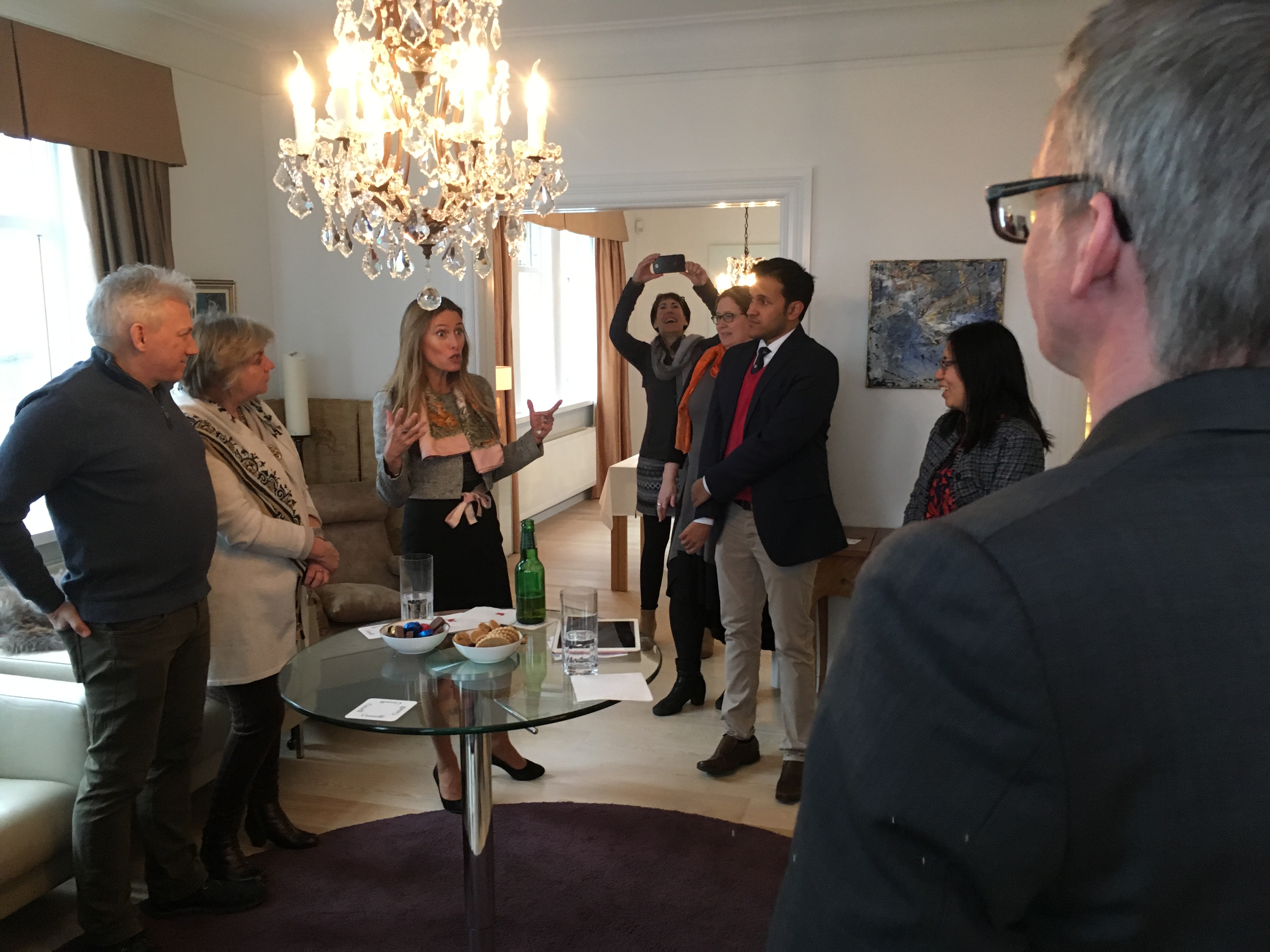 Workshop participants in conversation with Dr. Anne-Tamara Lorre, the Canadian Ambassador to Iceland informing about workshop outcomes