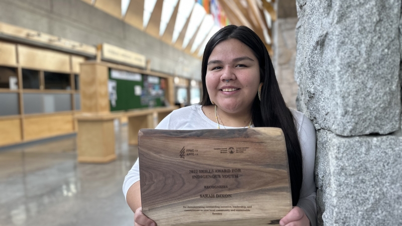 First Nations Studies student Sarah Dixon holds the plaque she received during National Forest Week this past fall